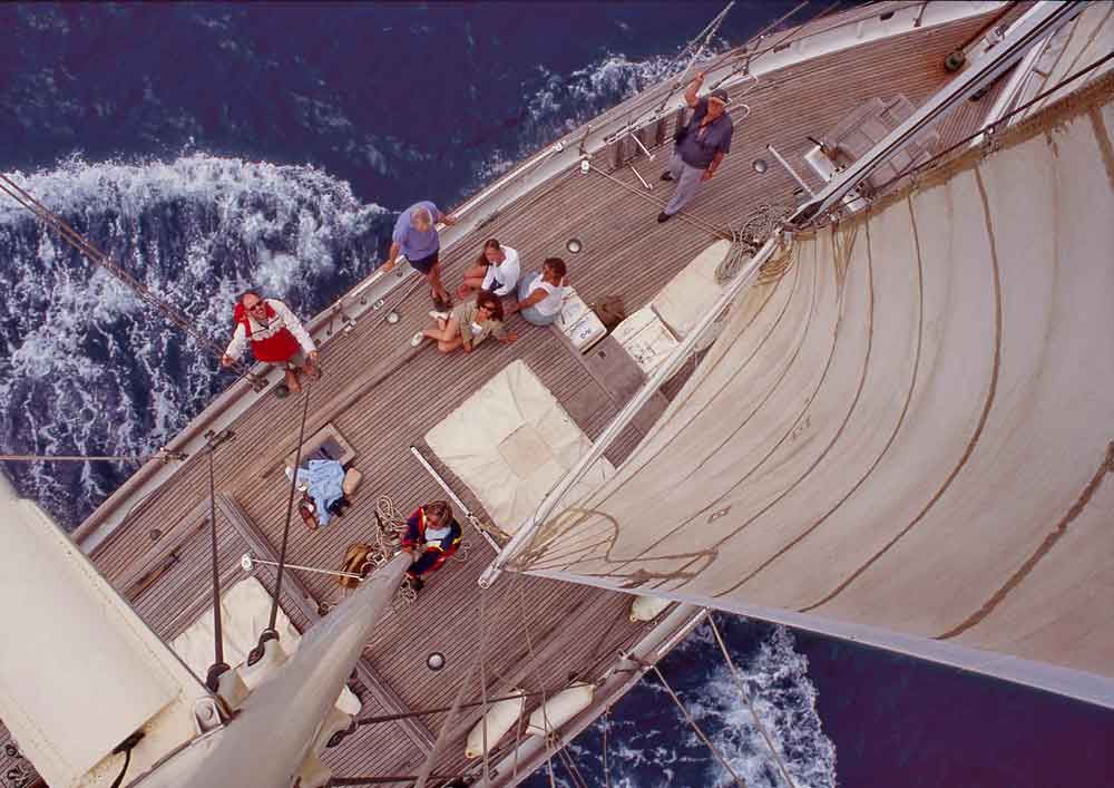 Aerial shot of sailing boat at sea