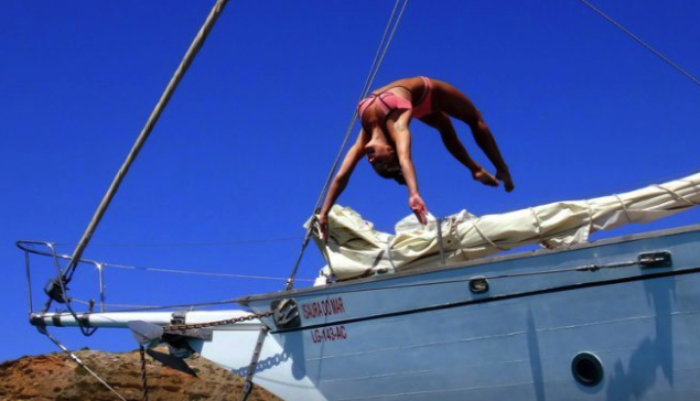 Girl diving off boat into sea